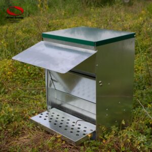 Treadle Chicken feeder in action closer