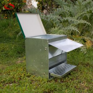 Treadle Chicken feeder in action flap cover open